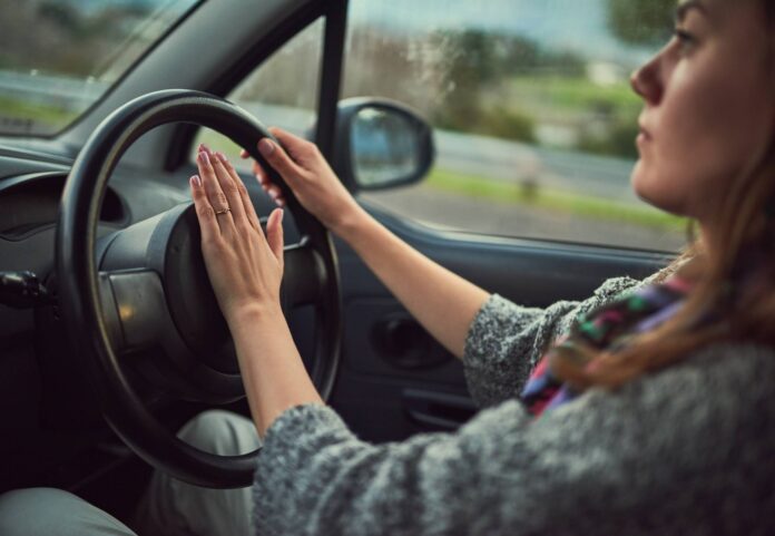 Woman,,Car,And,Driving,With,Honk,On,Road,For,Alert, Woman, car and driving with honk on road for alert, emergency or traffic in travel, trip or transport. Female person hooting in vehicle with steering wheel for sound, horn or beep for incoming speed